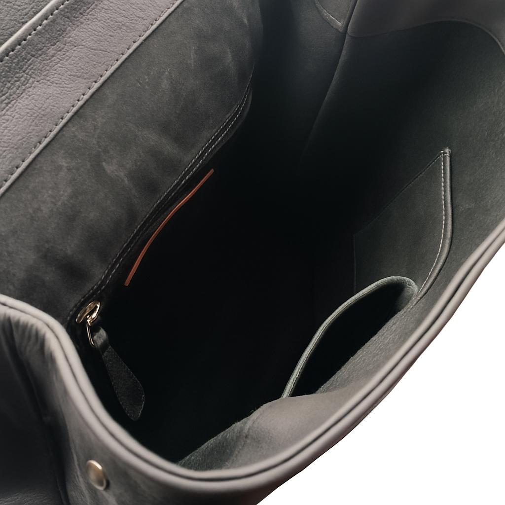 Open interior of Solstice with zip pocket and two slip pockets inside black leather backpack