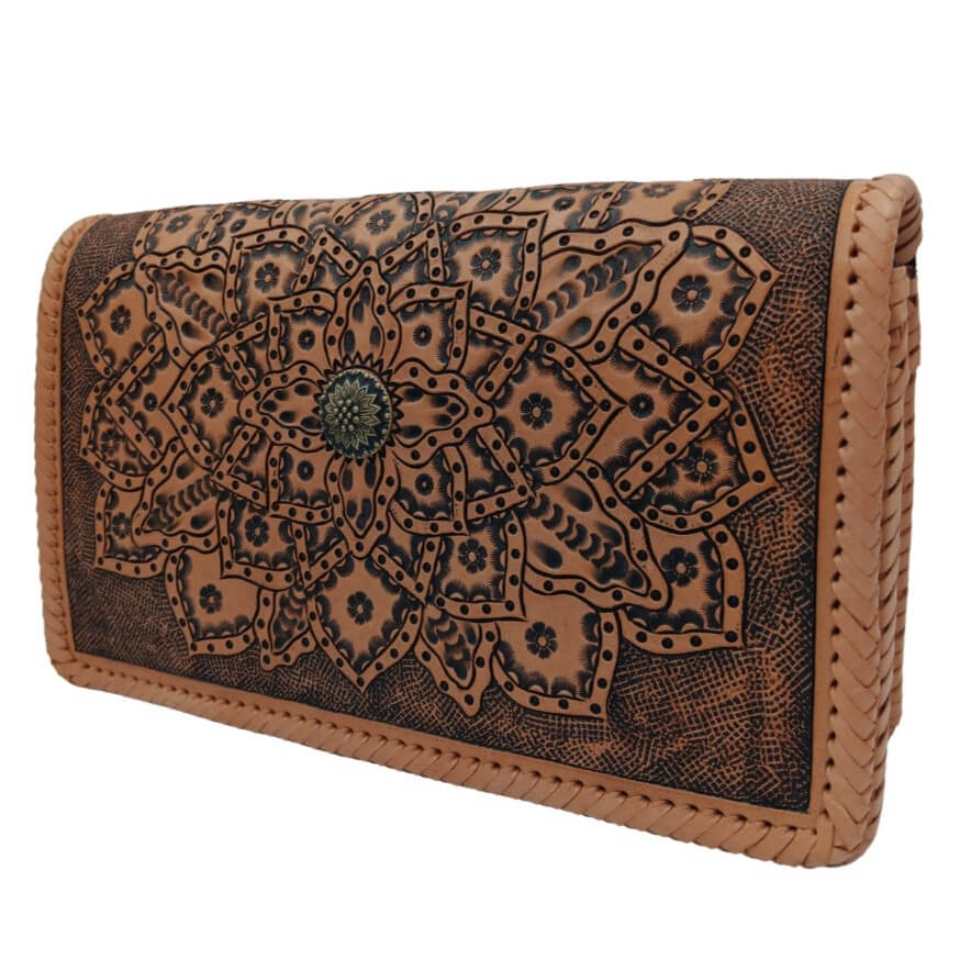 Three‑quarter right view of tooled leather crossbody highlighting layered mandala petals.
