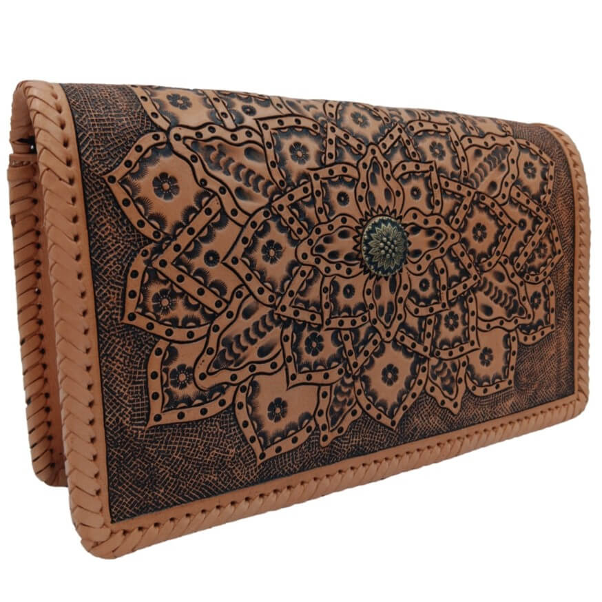Three‑quarter left view showing tooled mandala and depth of carving on full‑grain leather purse.