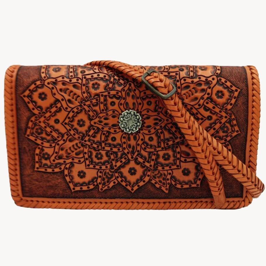 Crossbody strap attached; braided strap and front design visible on Crimson Legacy