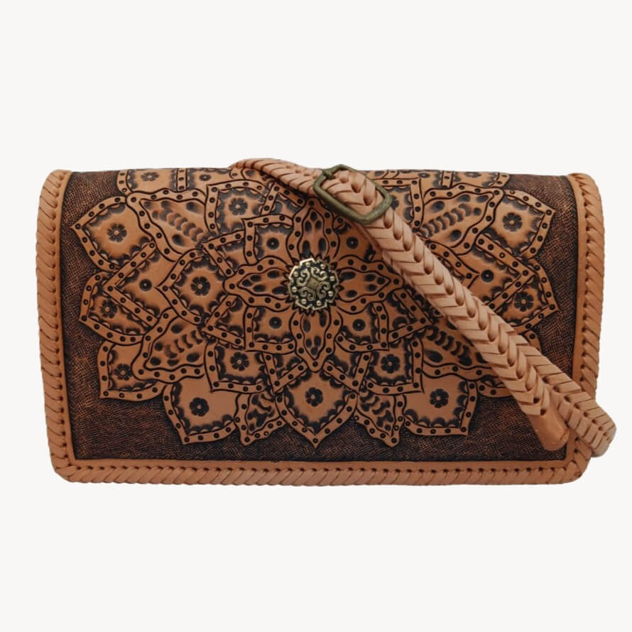 Full‑grain leather crossbody with braided strap and mandala tooling – Crimson Legacy