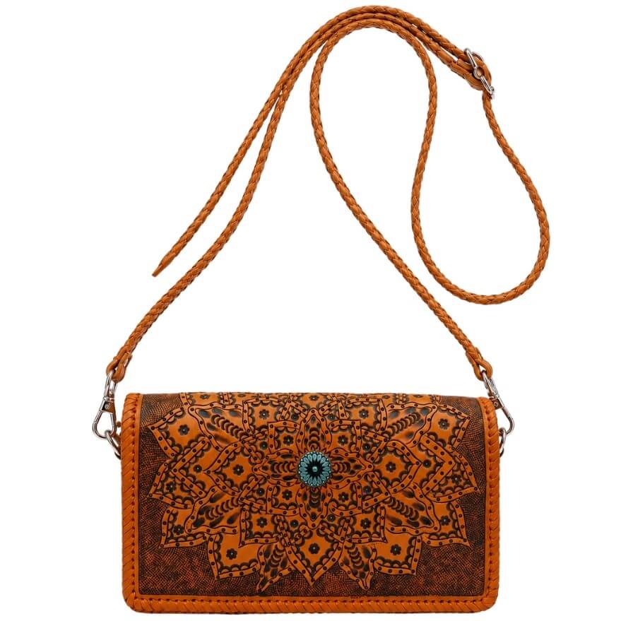 Elegant artisan leather wallet bag featuring detailed floral tooling, hand-laced trim, and platinum centerpiece