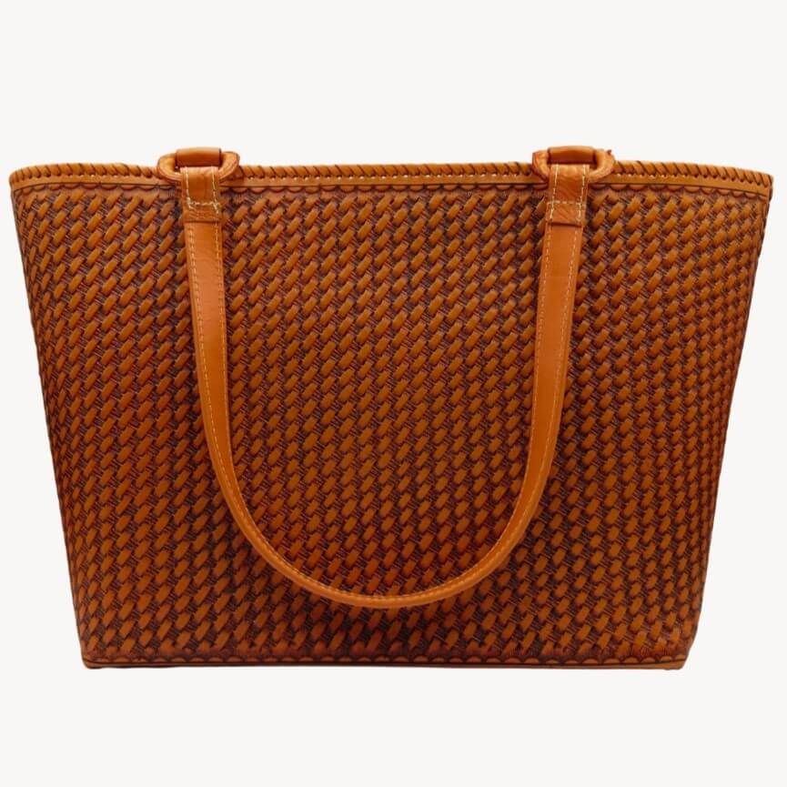 Honeycomb‑embossed back panel on full‑grain leather tote.