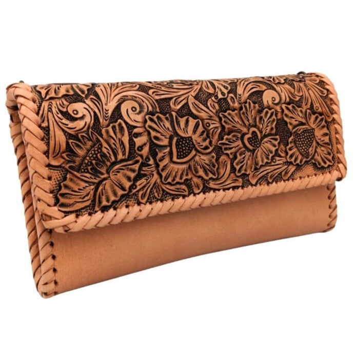 Angled right view of hand‑tooled leather purse with magnetic flap.