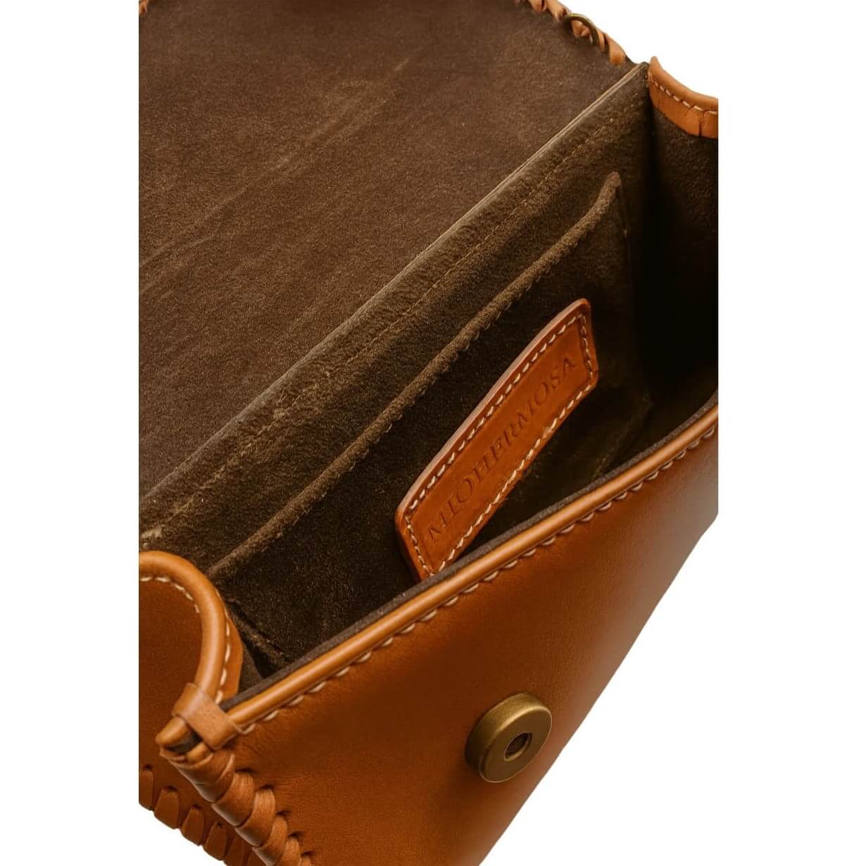 Interior view showing side pocket, suede‑like lining, and magnetic closure.