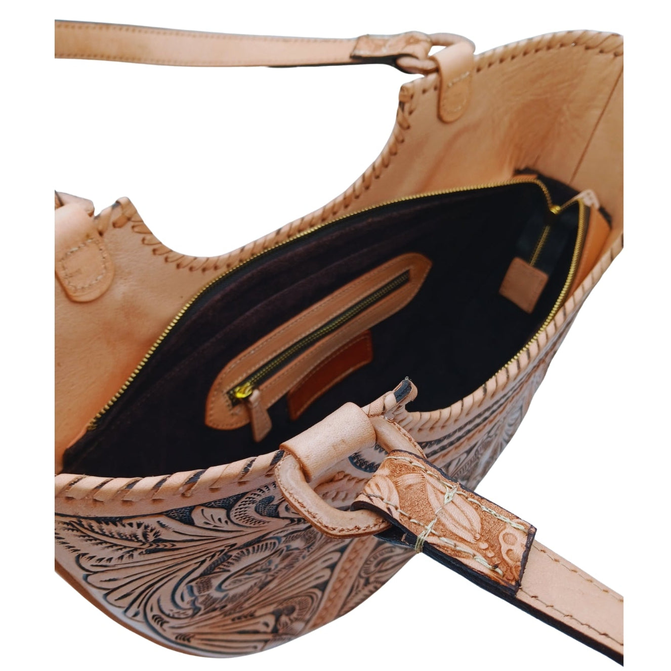 Interior of Flor de Cordoba Full Grain Tooled Satchel showing zip pocket and two slip pockets