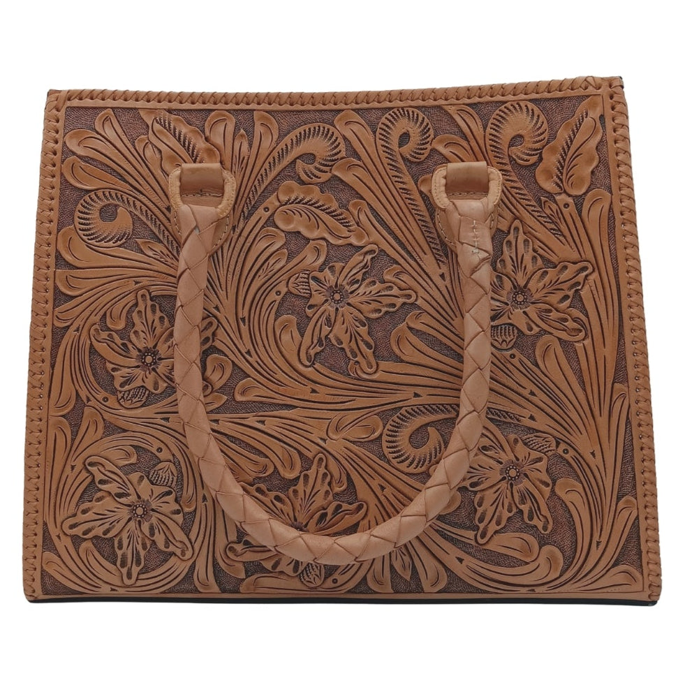 Flor de Miel Heritage Tote — hand‑tooled full‑grain leather floral design with braided handles