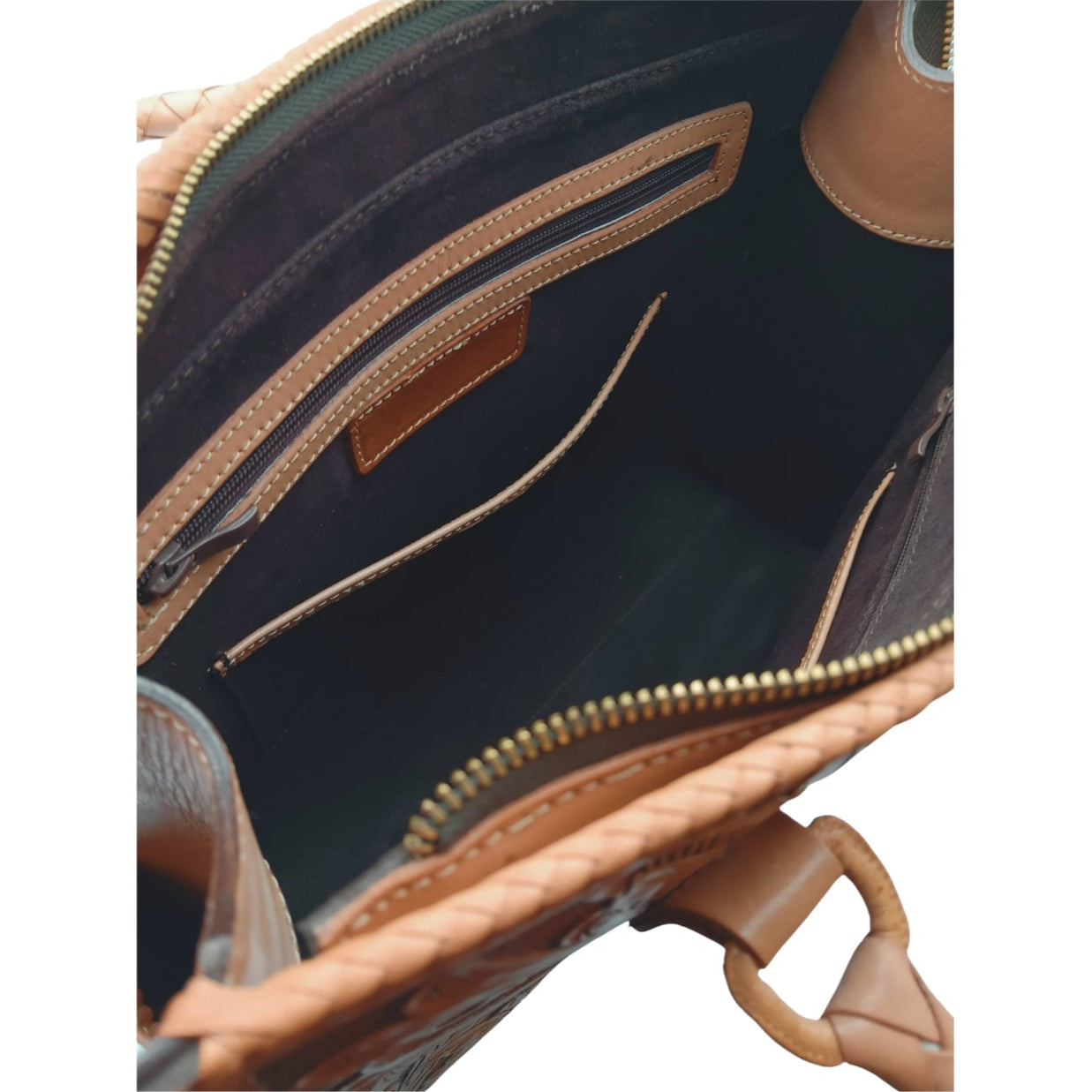 Suede‑lined interior of Flor de Miel Heritage Tote with top zipper, 2 zip pockets and 3 slip pockets