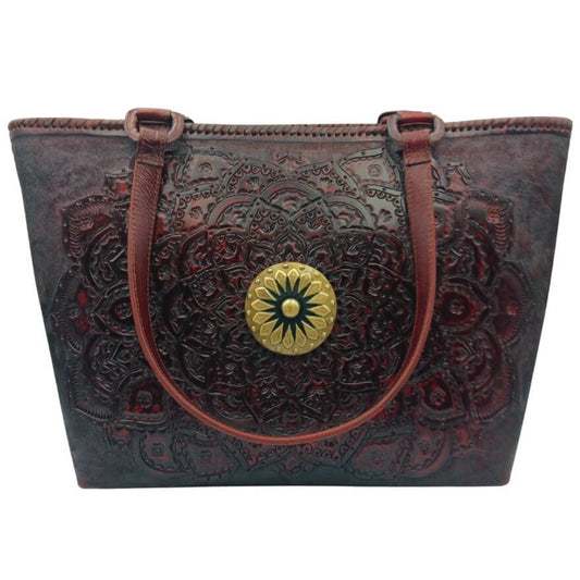 Front view—hand‑tooled full grain leather tote with mandala rosette and brass concho, cognac, Mahogany Espresso.