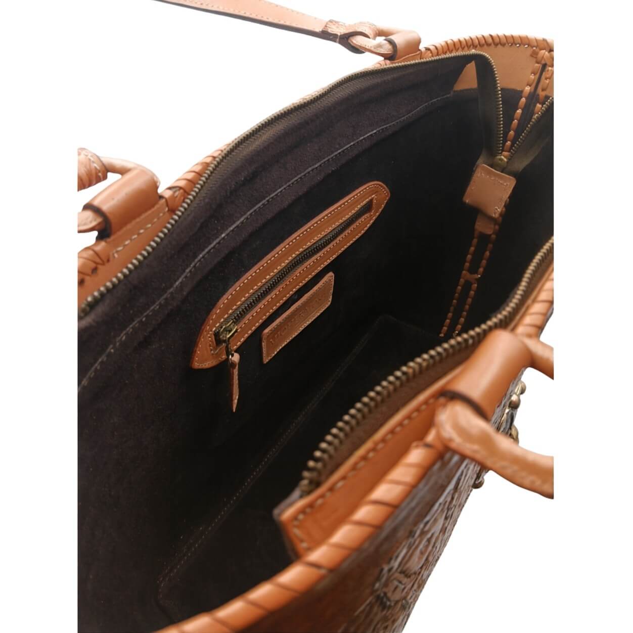 Interior—suede lining with zip pocket and two slip pockets; zip‑top closure.