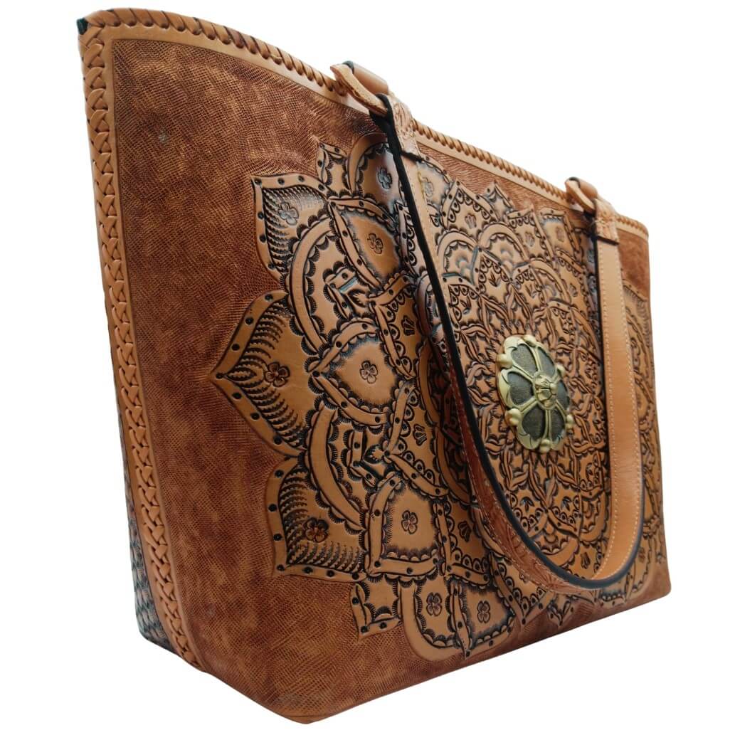 Full‑grain leather mandala tote, angled right, floral handles detail.