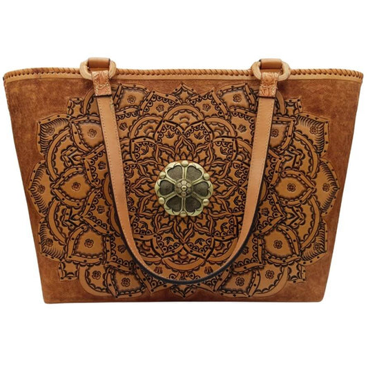 Full‑grain leather tote with embossed mandala and brass medallion, front view.
