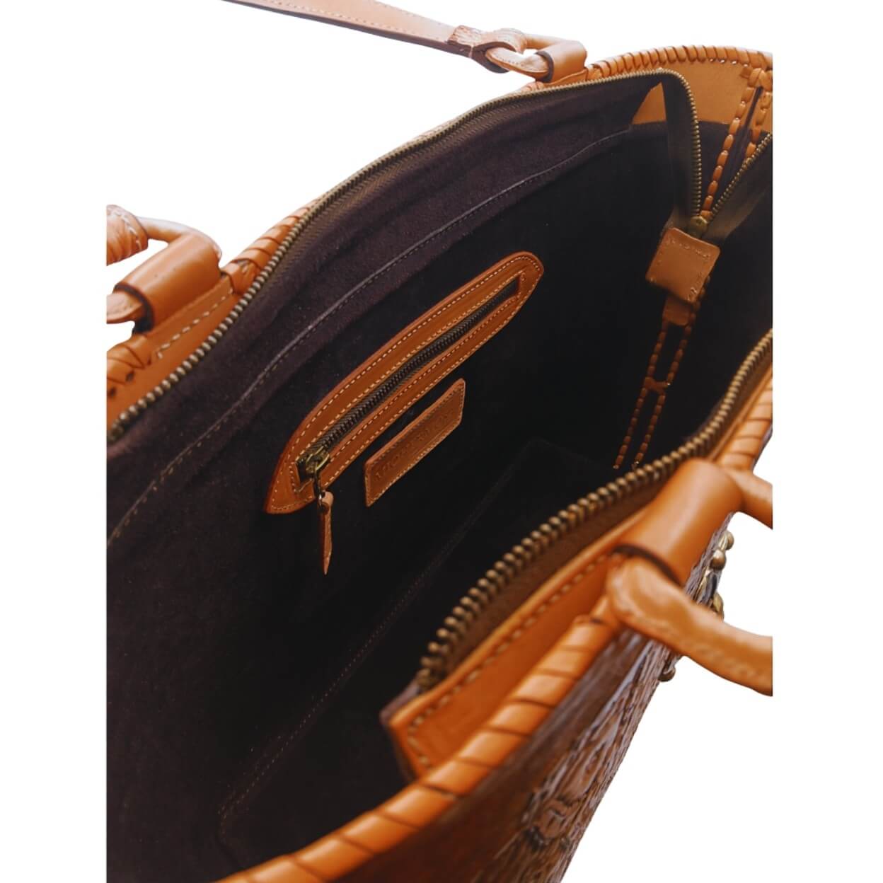 Suede‑lined interior with zip pocket and two slip pockets, zip closure.