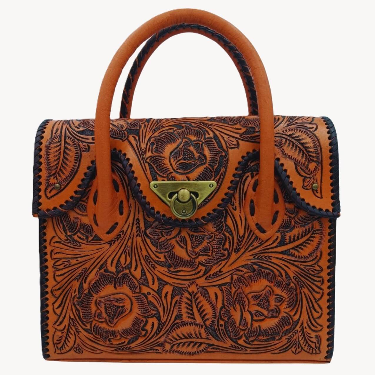 Front view of Miohermosa Mini Tote Full Grain Leather with hand‑tooled floral carving and turn‑lock