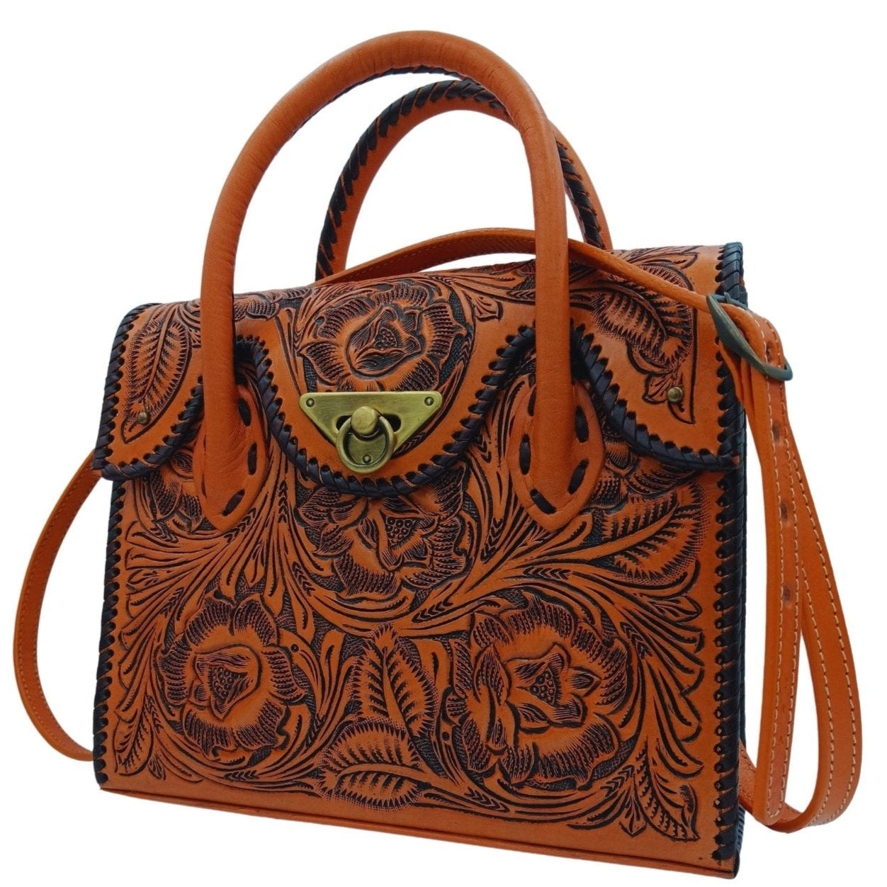 Angled view with removable crossbody strap on the tooled leather purse by Miohermosa