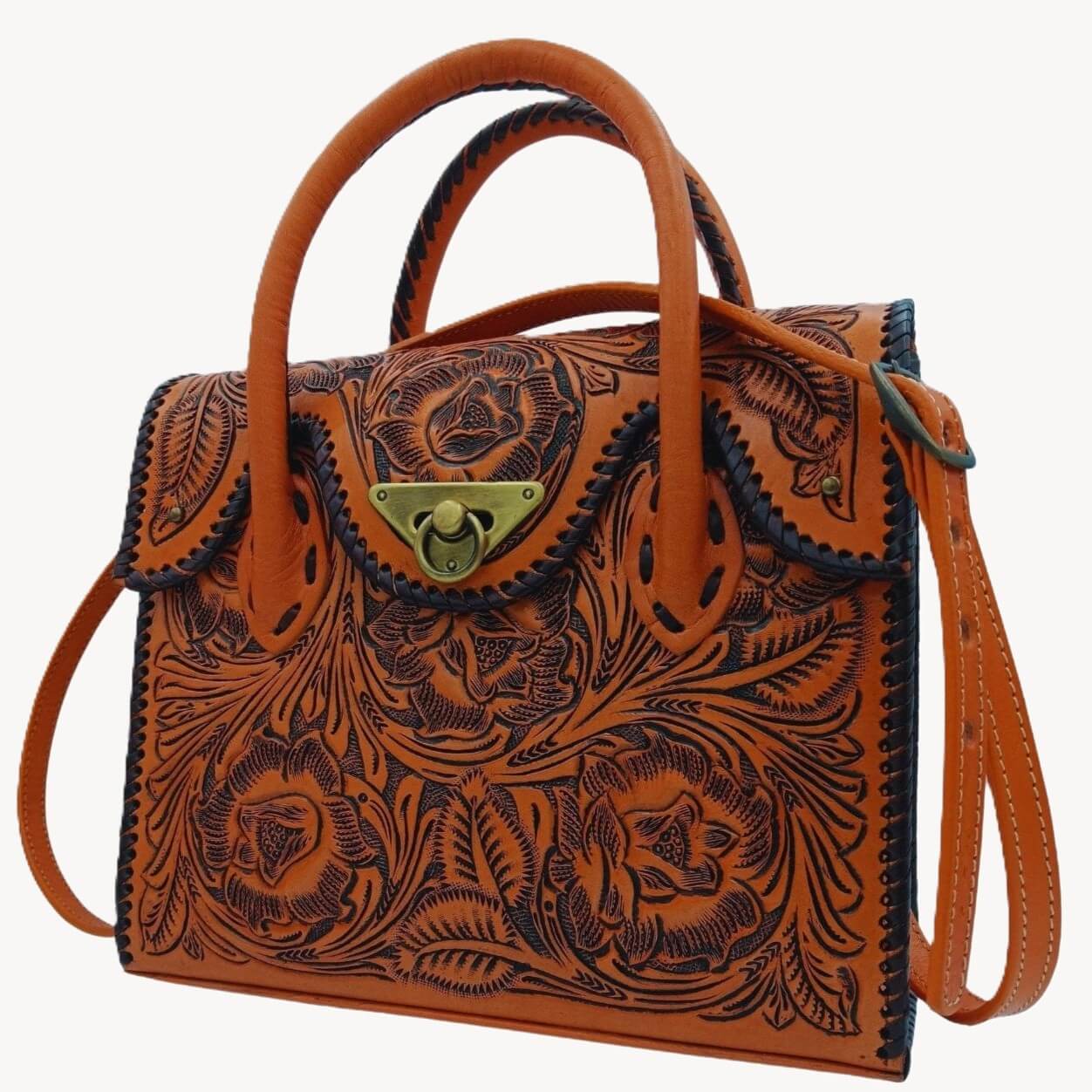 Angled view with removable crossbody strap on the tooled leather purse by Miohermosa