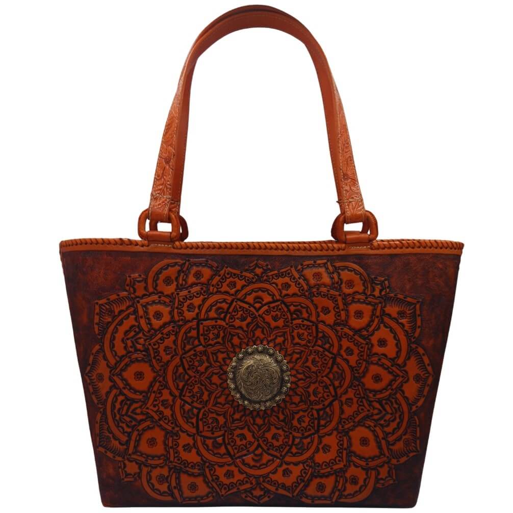 Close view of tooled handles and hand‑laced rim on leather tote.