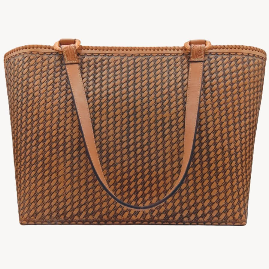 Back panel with honeycomb stamp on cognac full grain leather tote.