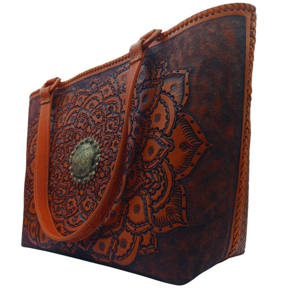 Right angle highlighting deep floral‑leaf tooling and center medallion.