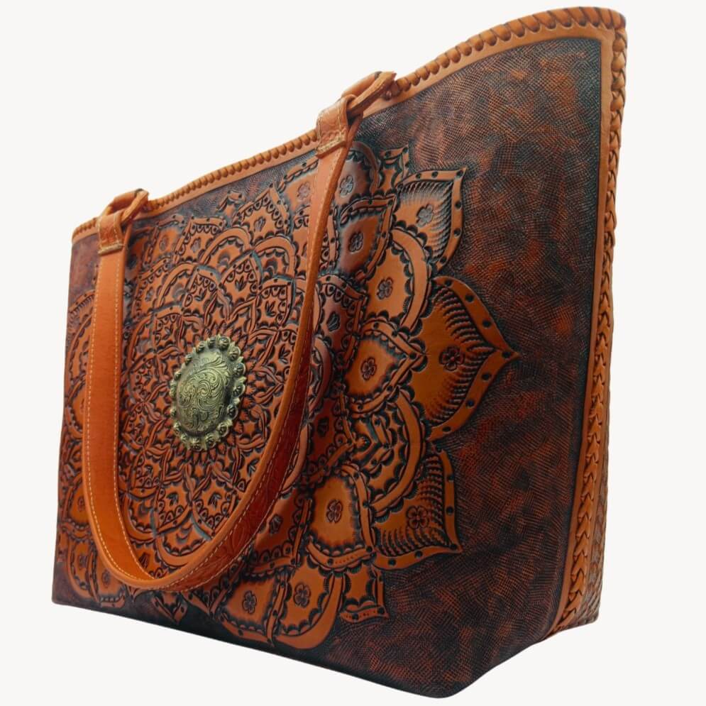 Right angle highlighting deep floral‑leaf tooling and center medallion.
