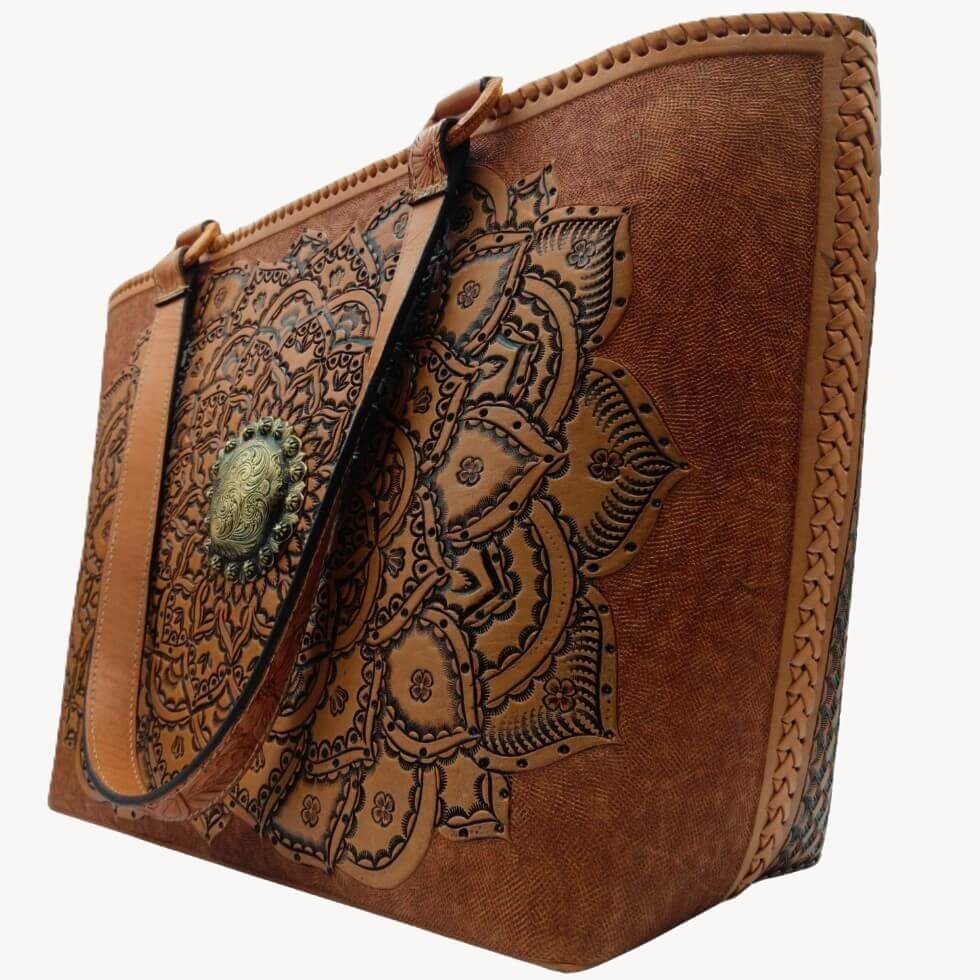 Right angle highlighting deep floral‑leaf tooling and center medallion.