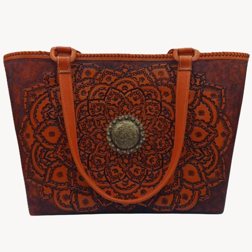 Front view of Sol de Oro full grain leather tote with hand‑tooled mandala and brass concho.