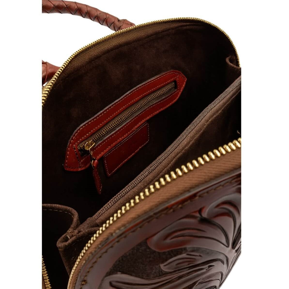 Interior of hand tooled leather purse with zip divider and pockets