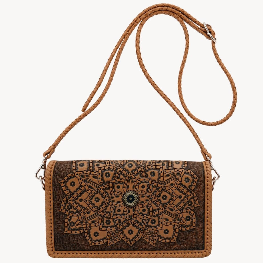 Natural tan embossed leather crossbody bag with mandala detailing, braided shoulder strap, silver hardware, and circular clasp on a white background.