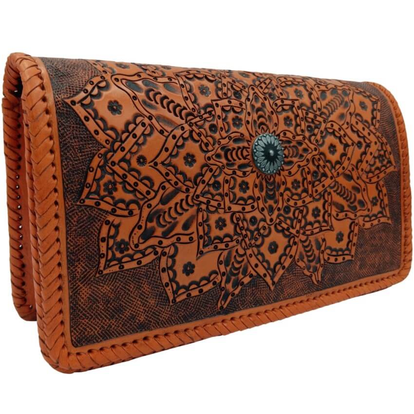 Side angle of Sedona Mandala Tooled Leather Crossbody showing embossed floral mandala and braided edges burnt orange