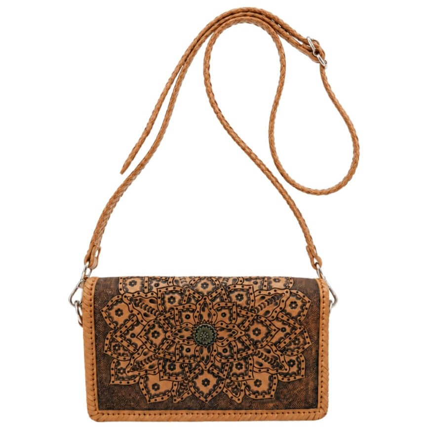 Full grain  leather crossbody bag with intricate patterns on a beige background