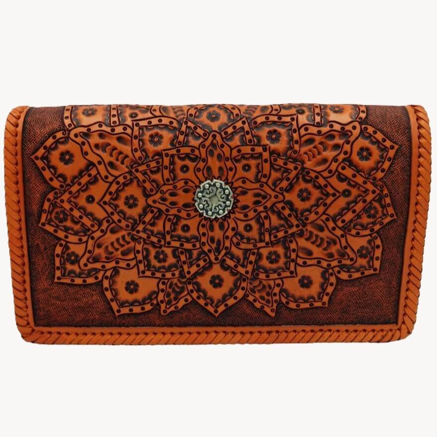 Front view of Crimson Legacy Full Grain tooled leather crossbody with mandala sunburst and center concho