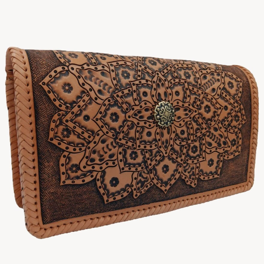 Angled left view of handmade tooled leather purse with mandala design – Crimson Legacy