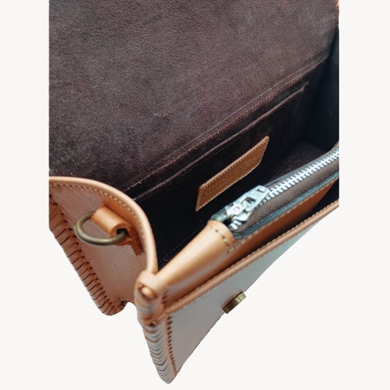 Interior of suede‑lined handbag with zip pocket and slip pocket – Crimson Legacy