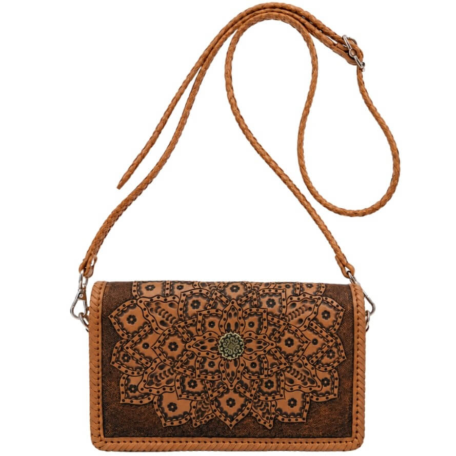 Brown leather crossbody bag with intricate patterns on a beige background