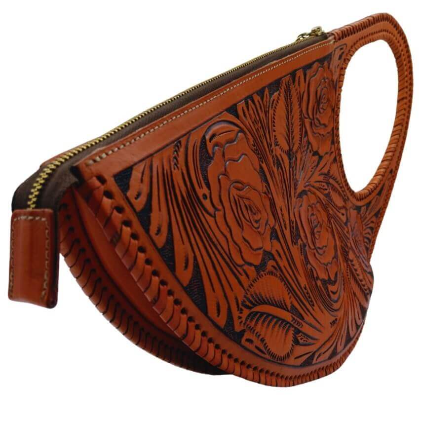 side angle showing zip closure and tooling detail on handmade leather purse