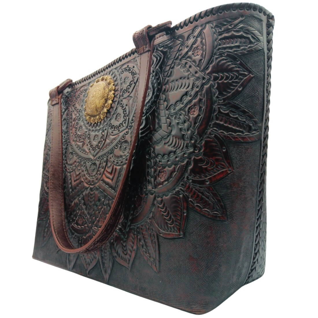 Tooled leather tote with concho medallion and leaf details, angled view.