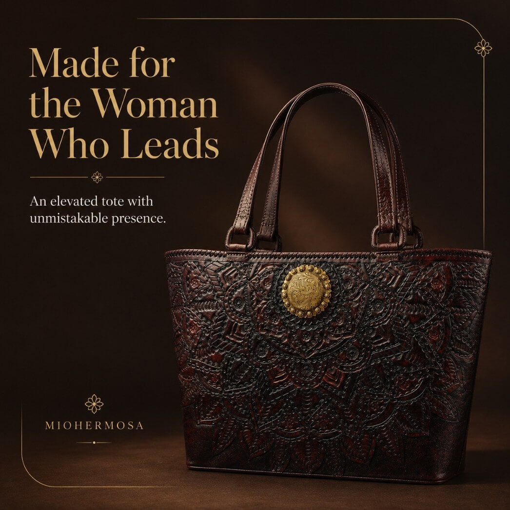 Mahogany espresso floral embossed leather tote with top handles and a round gold medallion in a luxury editorial graphic.