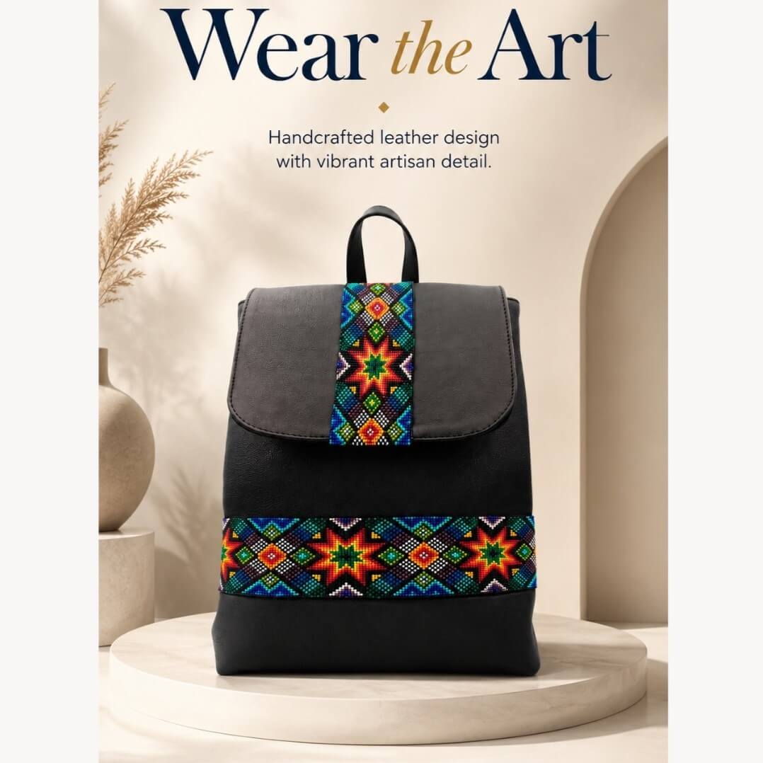Black leather backpack with colorful woven geometric textile panels displayed on a cream pedestal with Wear the Art headline.