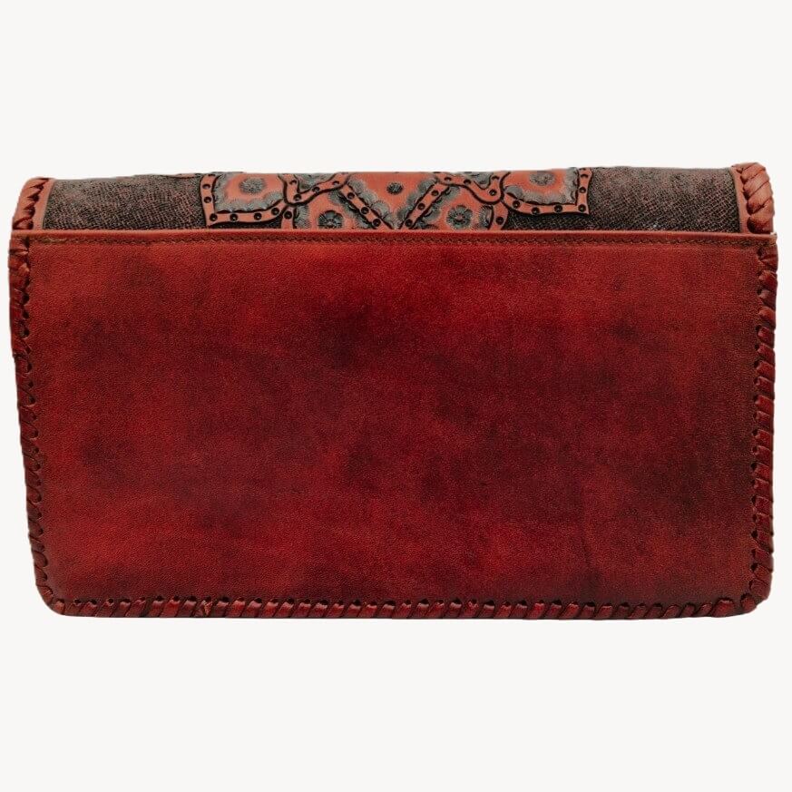 Back of bag—smooth burnished crimson leather with exterior slip pocket and whipstitch edges.