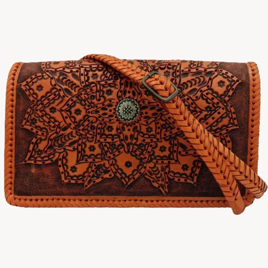 Full‑grain leather crossbody with braided adjustable strap and magnetic flap