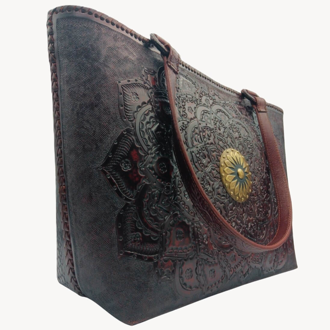 Angled left—tooled leather purse showing mandala detail and strap drop, Mahogany Espresso. 