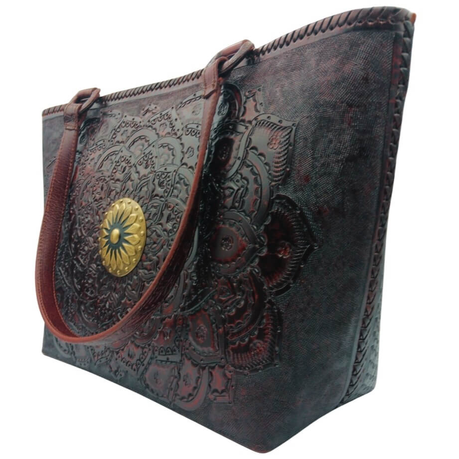 Angled right—mandala tooling and hand‑laced side on full‑grain leather tote, Mahogany Espresso. 