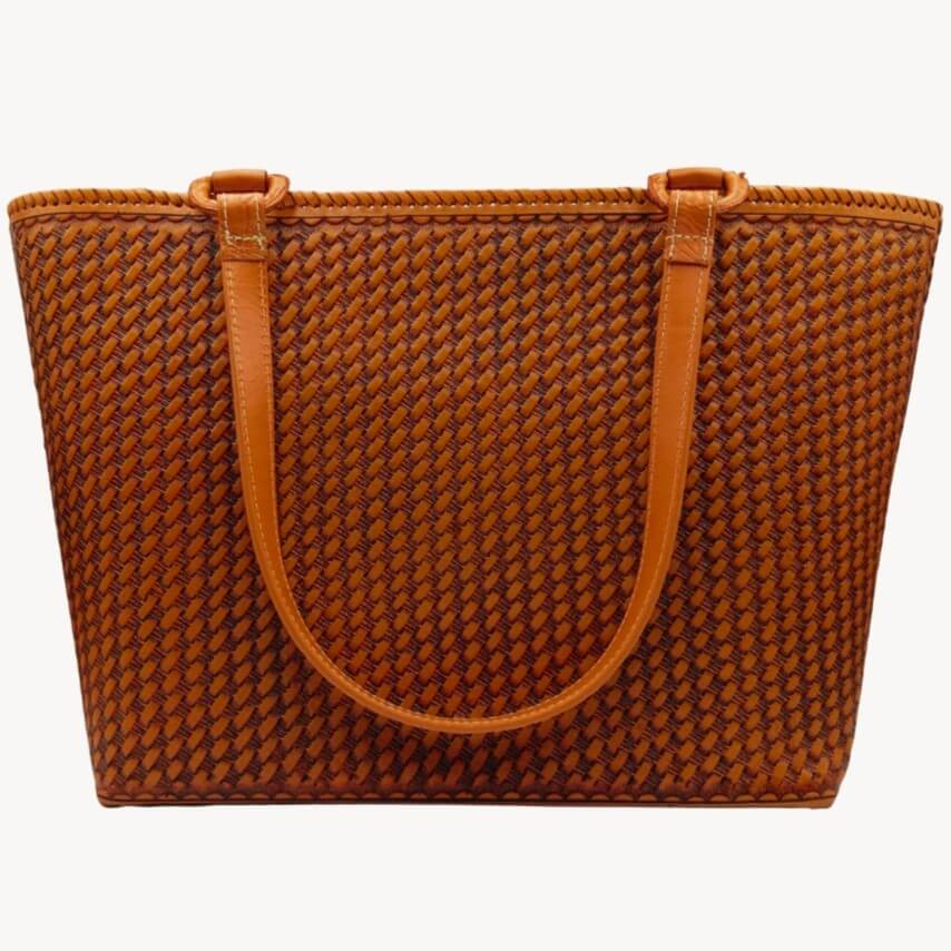 Back panel with honeycomb stamp on cognac full grain leather tote.