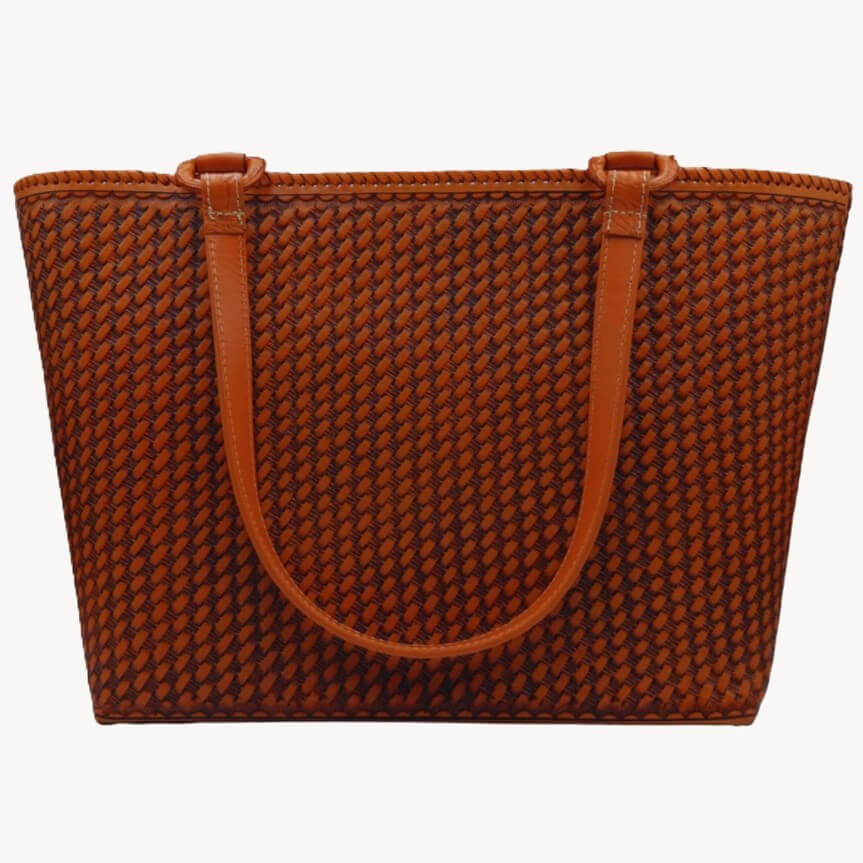 Back panel with honeycomb stamp on cognac full grain leather tote.