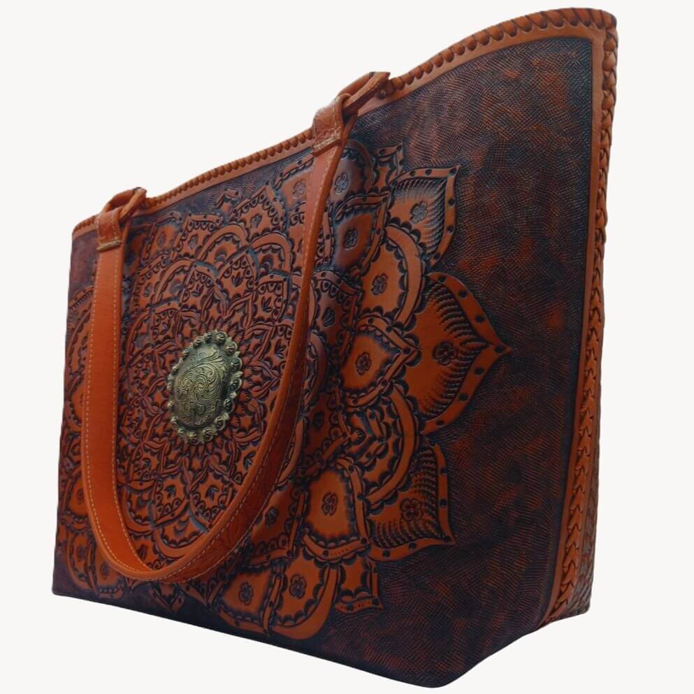 Right angle highlighting deep floral‑leaf tooling and center medallion.
