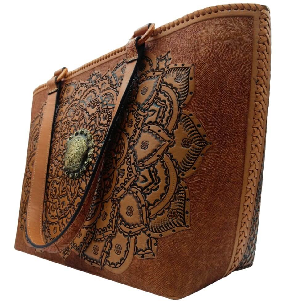Right angle highlighting deep floral‑leaf tooling and center medallion.