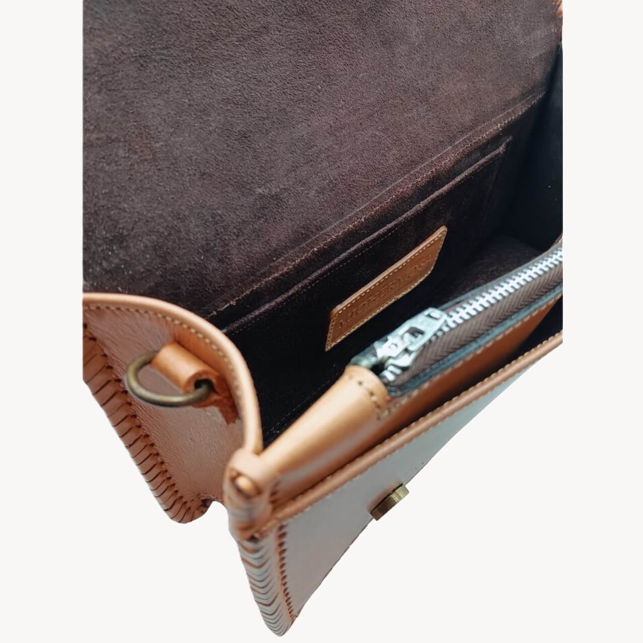 Interior suede lining with zip pocket and magnetic closure